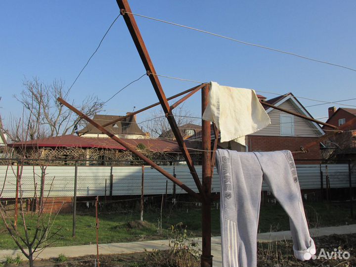 Вращающаяся сушилка для белья уличная