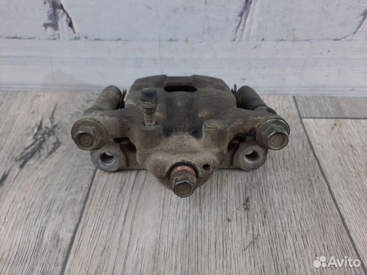 Суппорт тормозной задний правый Tiida Juke Qashqai