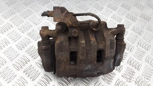 Суппорт тормозной передний левый mitsubishi L200 K