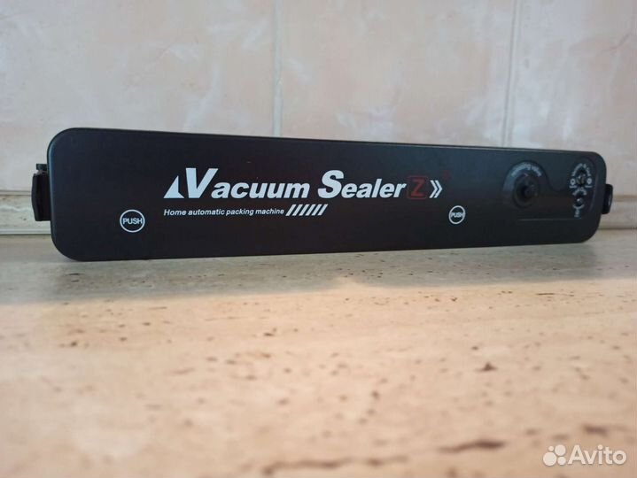 Вакуумный упаковщик