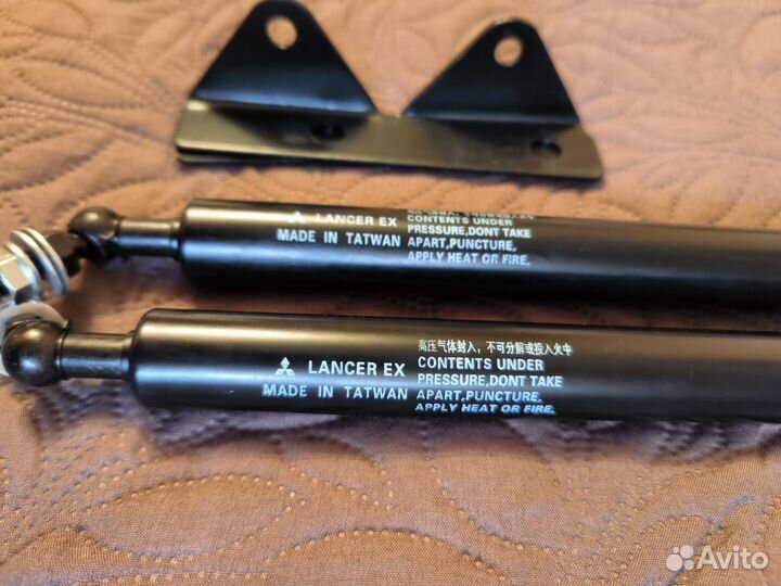 Газовые упоры капота lancer x