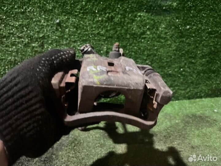 Суппорт тормозной задний правый Nissan Primera