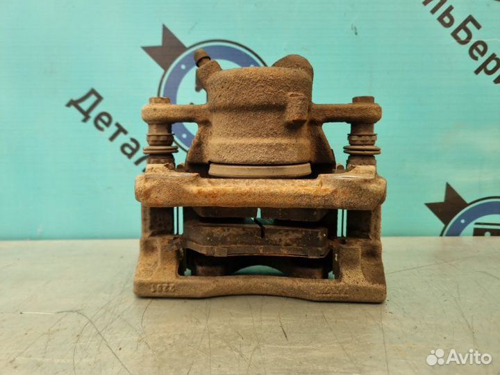 Суппорт тормозной передний левый Nissan Almera G15