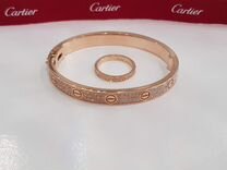 Золотой браслет и кольцо Cartier Love