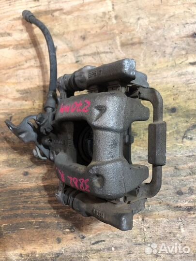 Суппорт задний левый Volkswagen Golf 5K5 caxa