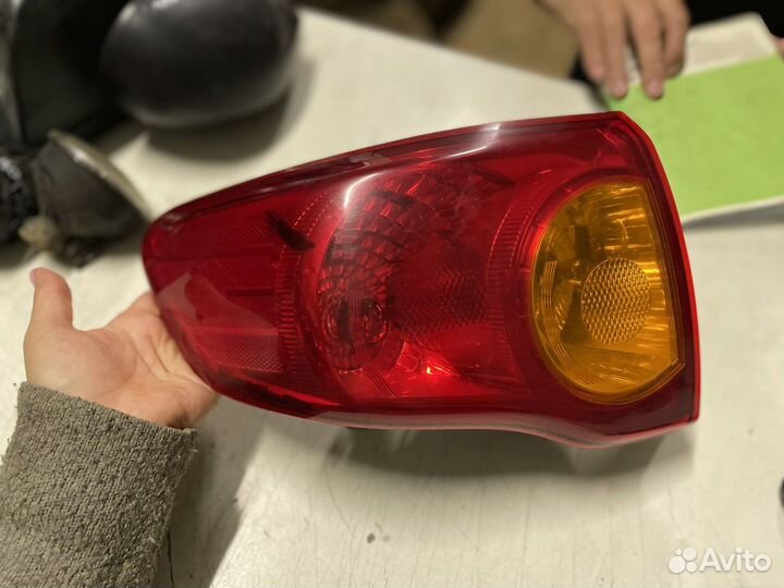 Фонарь задний левый Toyota Corolla E150