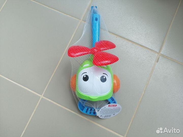 Игрушка каталка с ручкой