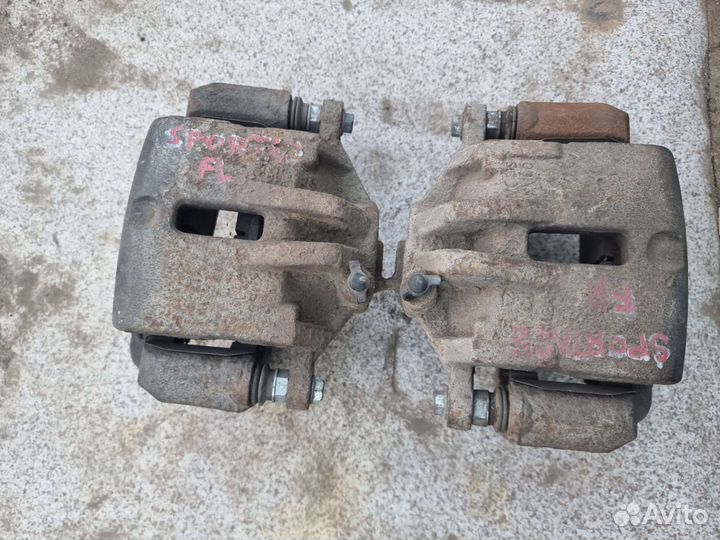 Суппорт передний Kia Sportage 2