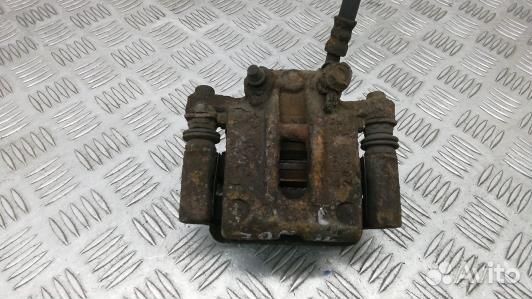 Суппорт тормозной задний левый toyota corolla E12