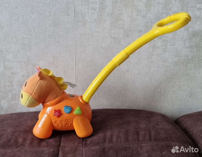 Музыкальная каталка лошадка