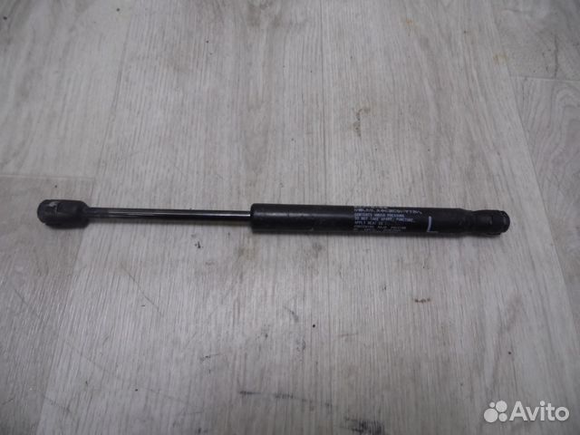 Амортизатор крышки багажника левый Mitsubishi Lanc