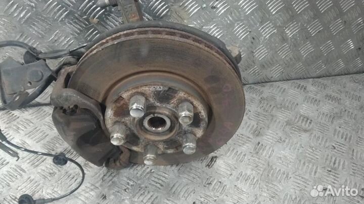 Кулак поворотный левый Mitsubishi Lancer 10 (07-10)