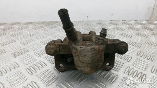 Суппорт тормозной задний левый toyota corolla E12