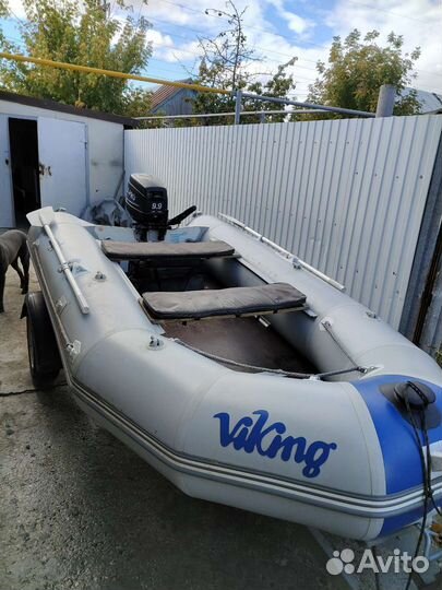 Лодка с мотором и прицепом
