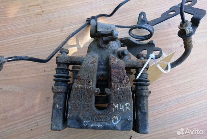 Суппорт тормозной задний правый на Форд Мондео 4