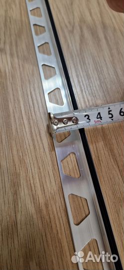 Соединительный порог между плиткой и ламинатом