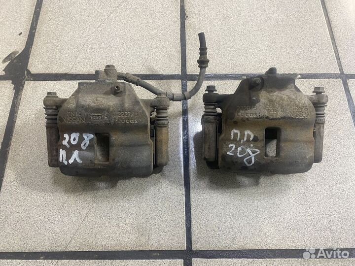 Суппорт тормозной передний Nissan Primera P11