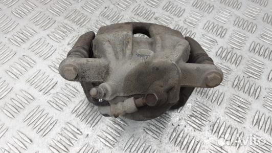 Суппорт тормозной передний левый nissan note E11