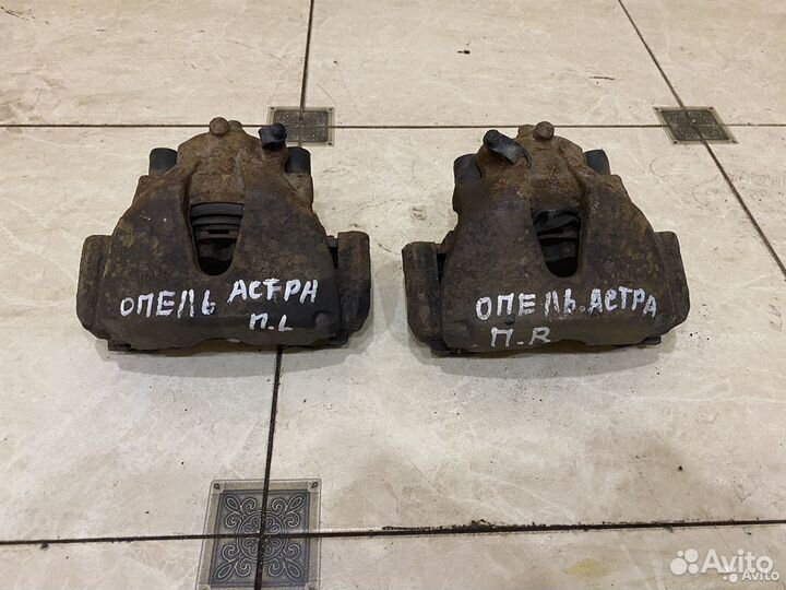 Тормозной суппорт передний правый Opel Astra G