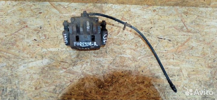 Суппорт тормозной передний левый Subaru Forester