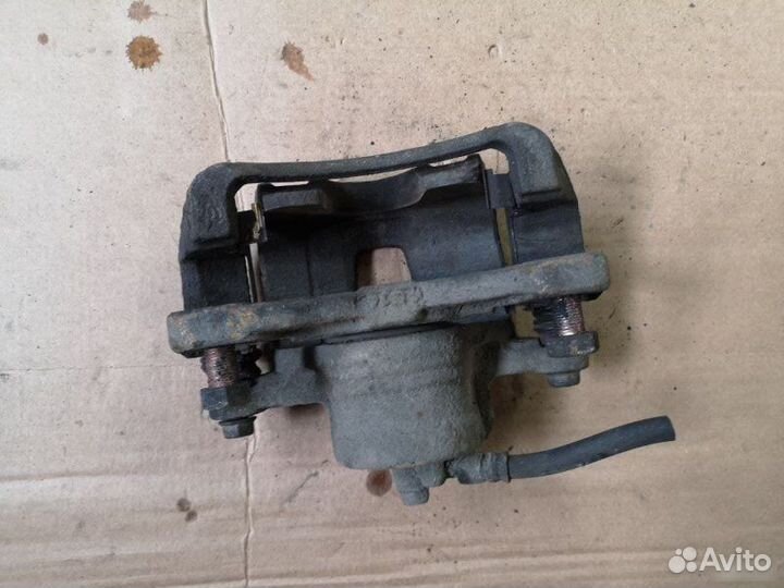 Суппорт передний левый Chevrolet Lacetti