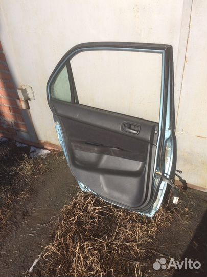 Задняя левая дверь ланцер 9