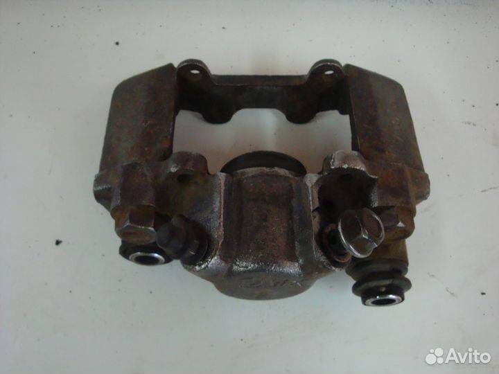 Суппорт тормозной задний левый Chery Tiggo