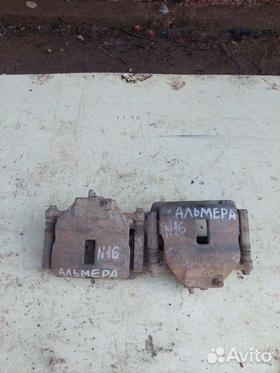 Суппорт левый передний на nissan almera N16