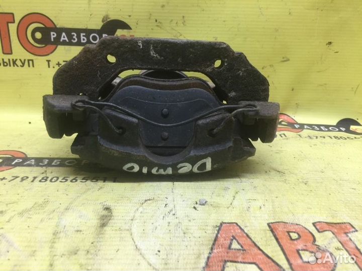 Суппорт передний левый Mazda Demio DY DY3W 2003