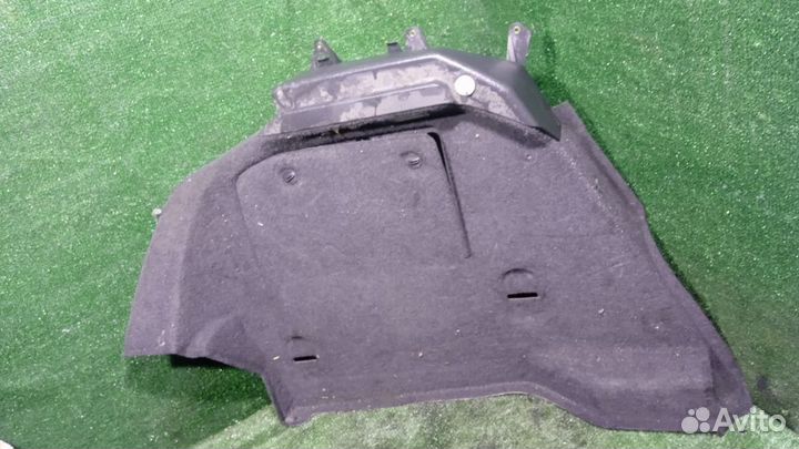 Обшивка багажника левая Opel Astra