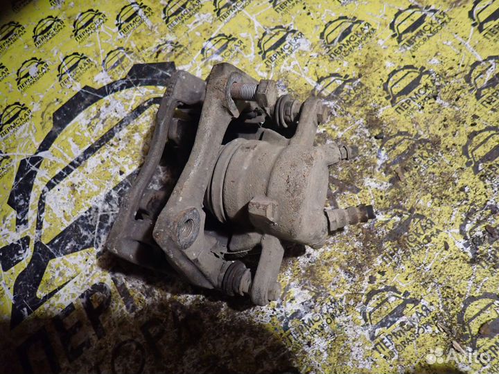 Суппорт тормозной передний левый Nissan Almera G15