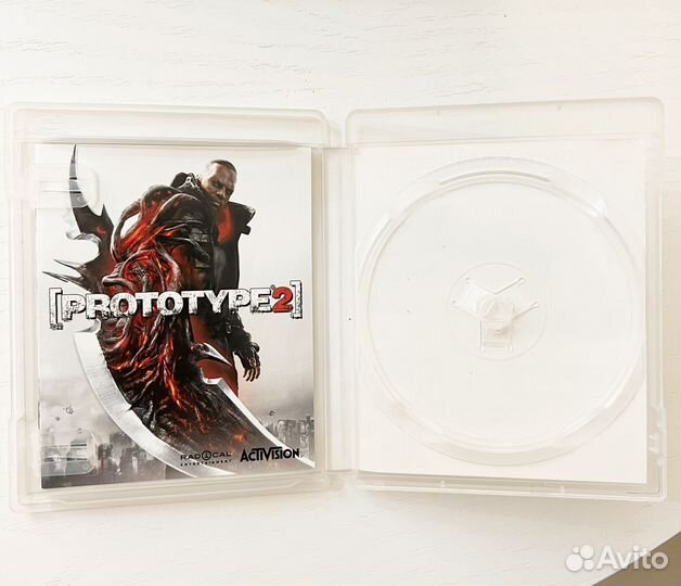 Коробка с мануалом от игры Prototip 2 для PS3