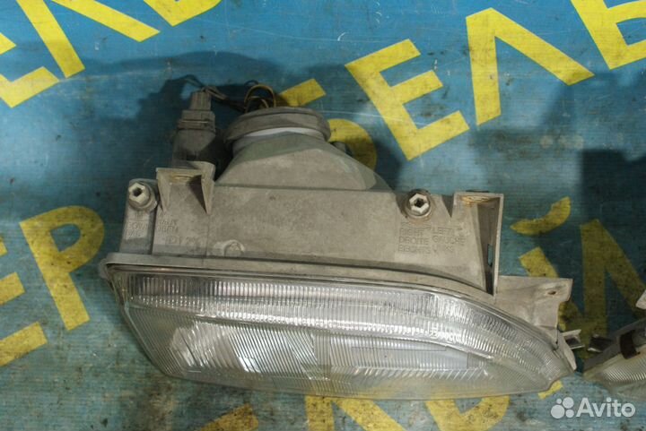 Передняя фара Ford Escort