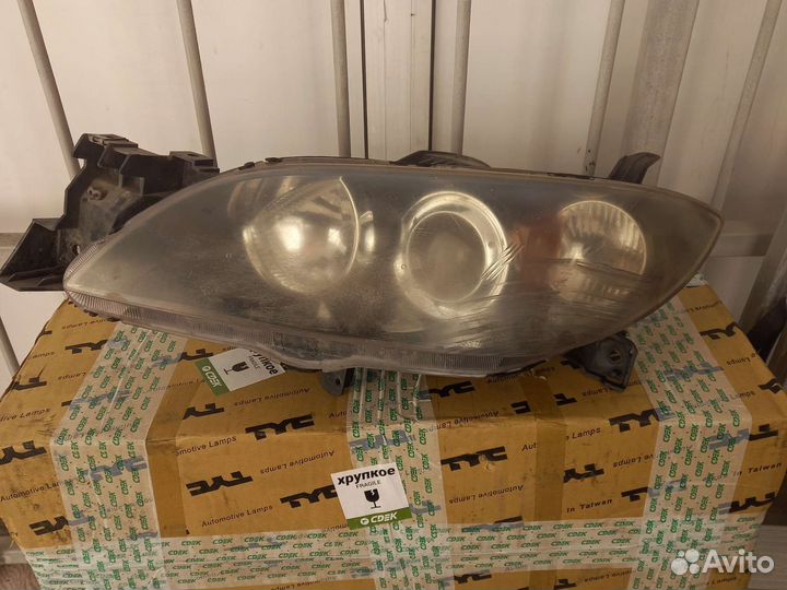 Фара мазда аксела седан левая