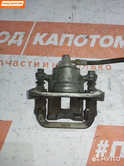 Суппорт тормозной задний левый Nissan X-Trail T31