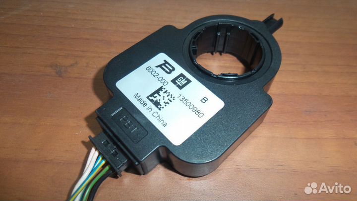 Датчик угла поворота руля Opel Astra J