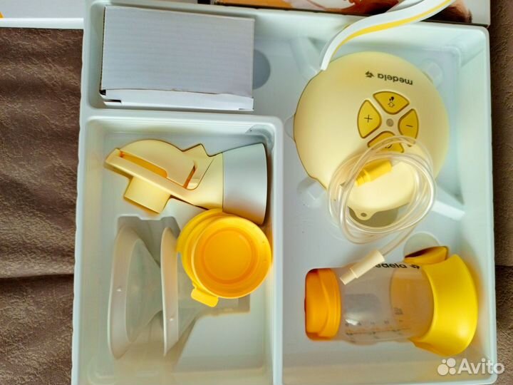 Молокоотсос medela электрический