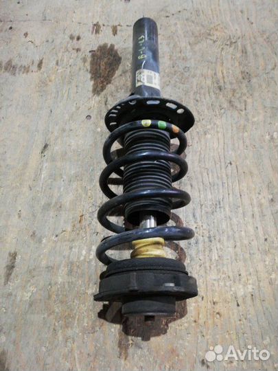 Стойка амортизатора передняя Volkswagen Passat B6