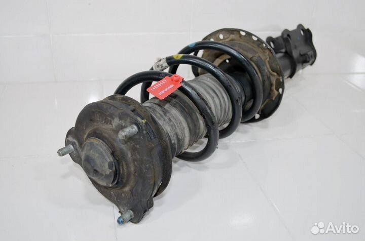 Стойка амортизатора передняя правая Kia Sportage 4