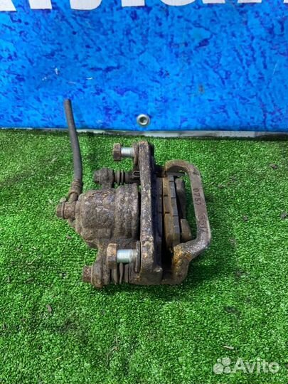 Суппорт тормозной задний правый Nissan Qashqai J10