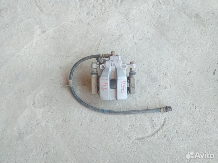 Суппорт тормозной задний левый Toyota Camry V50