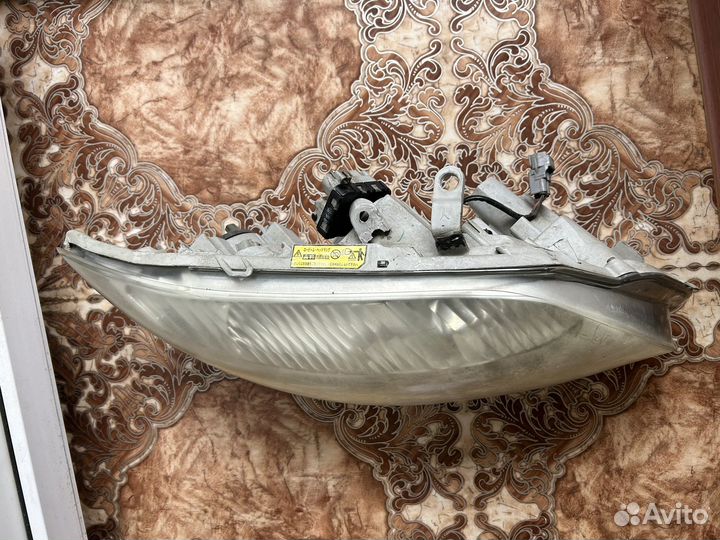 Фара Toyota corolla fielder NZE 141