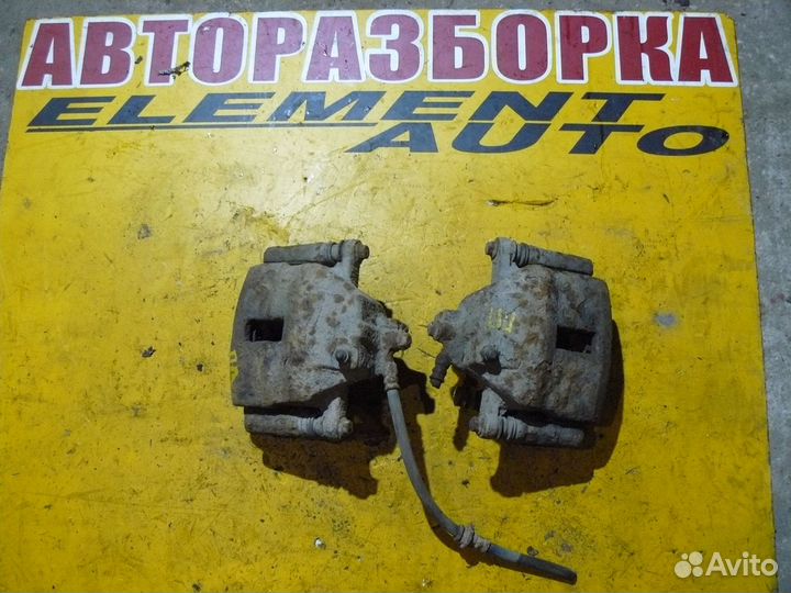 Суппорт тормозной передний Nissan Almera N16