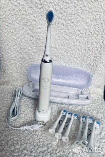 Электрическая зубная щетка