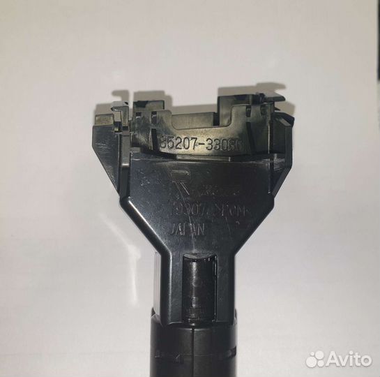 Форсунка омывателя фары правая