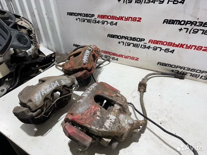 Суппорт передний правый левый Mazda 3 BK