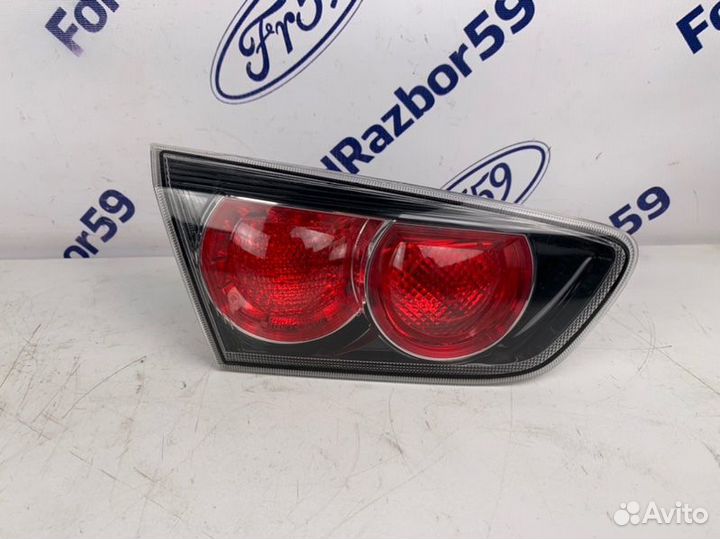 Фонарь в крышку багажника задний левый Mitsubishi