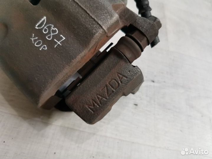 Суппорт тормозной передний левый Mazda 6 GH 2.0 LF