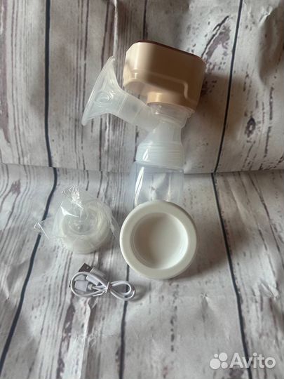 Молокоотсос электрический новый