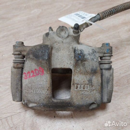 Суппорт тормозной передний левый Geely Emgrand EC7